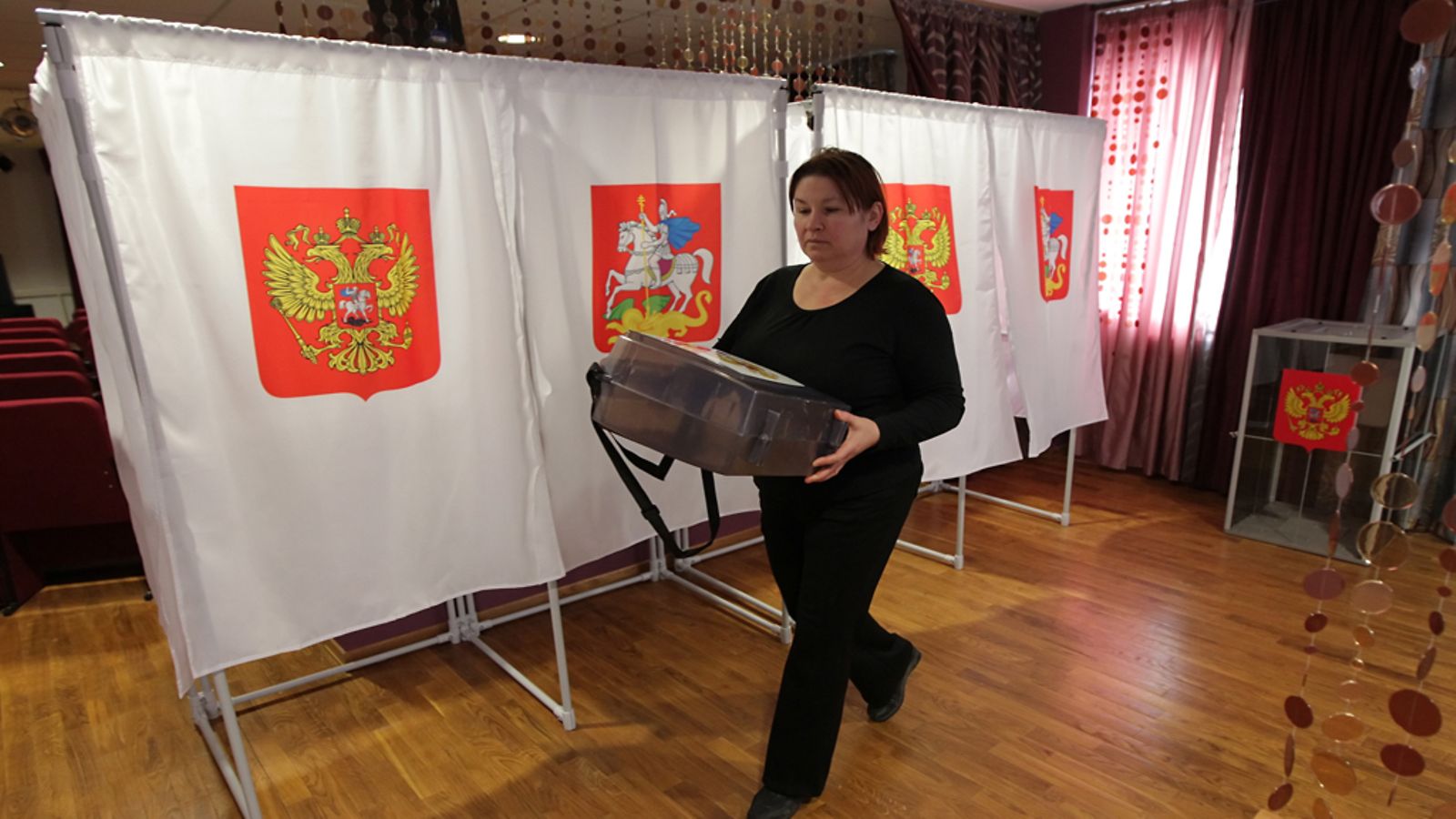 Members of the local election commission prepare a polling station in the town of Podolsk, some 20 km south of Moscow, Russia, 03 March 2012. Russia's Interior Ministry said it had deployed around 450,000 soldiers and police to protect voters during this weekend's presidential election, Itar-Tass news agency reported on 03 March. EPA/MAXIM SHIPENKOV  Epa