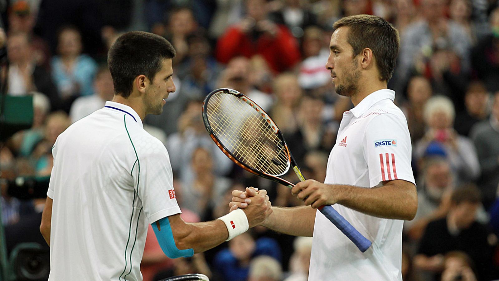 Novak Djokovic ja Viktor Troicki kohtasivat Wimbledonissa vuonna 2012.