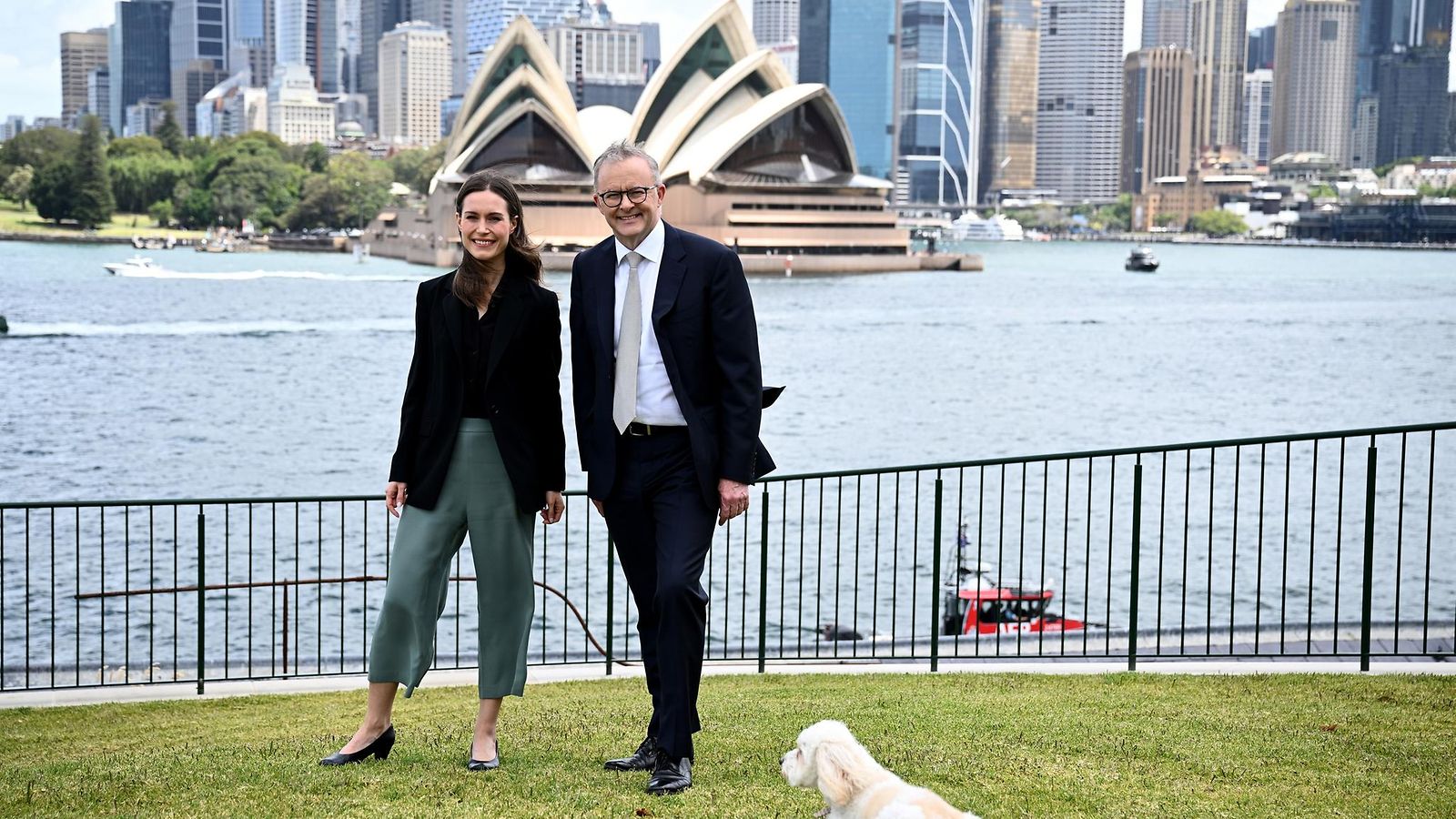 Finland Prime Minister Sanna Marin (L) poses with Australia Prime Minister Anthony Albanese and his dog Toto during a visit at Kirribilli House, in Sydney, Australia, 02 December 2022.