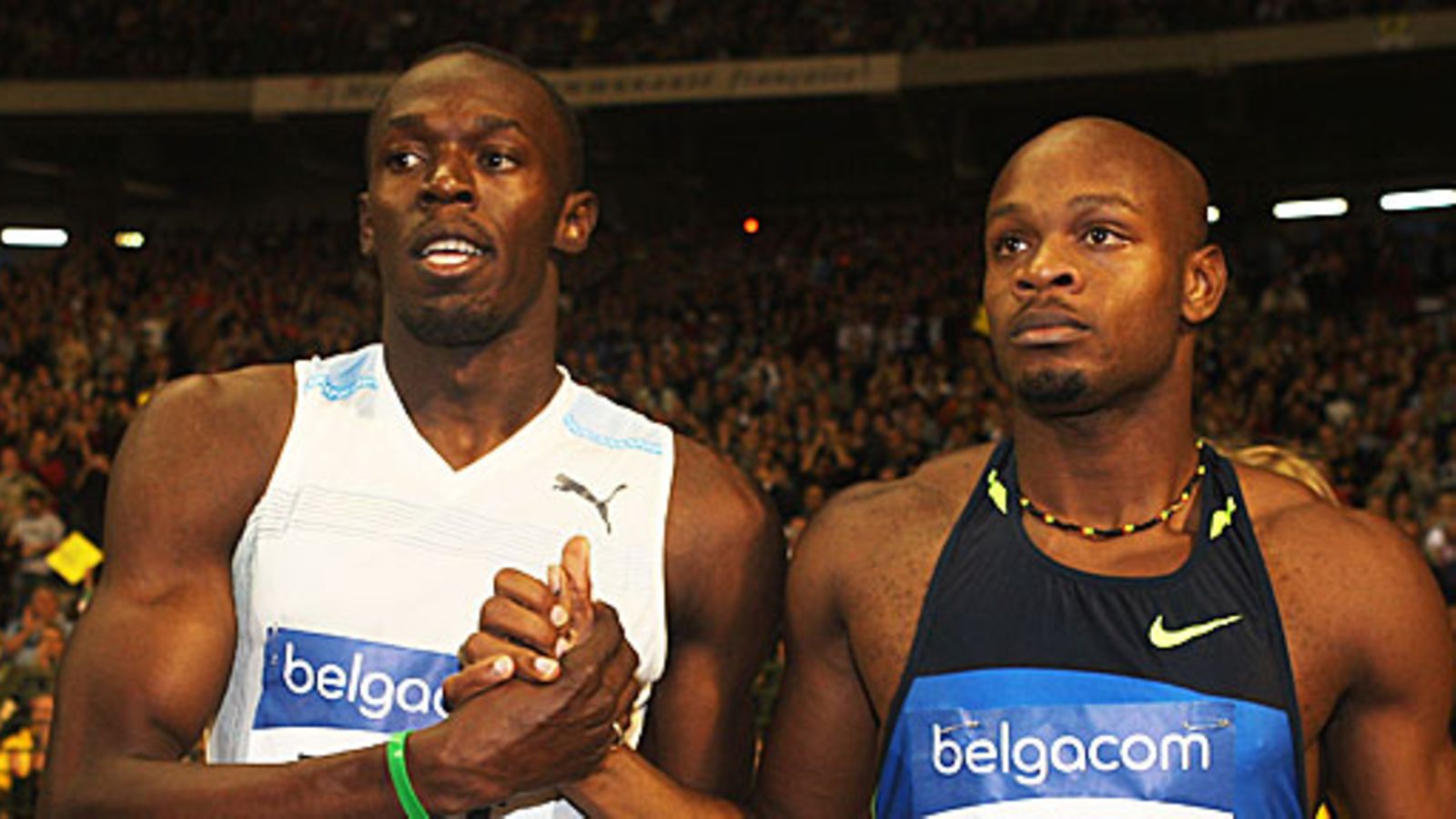Usain Bolt ja Asafa Powell. Kuva: Hamish Blair/GETTY.