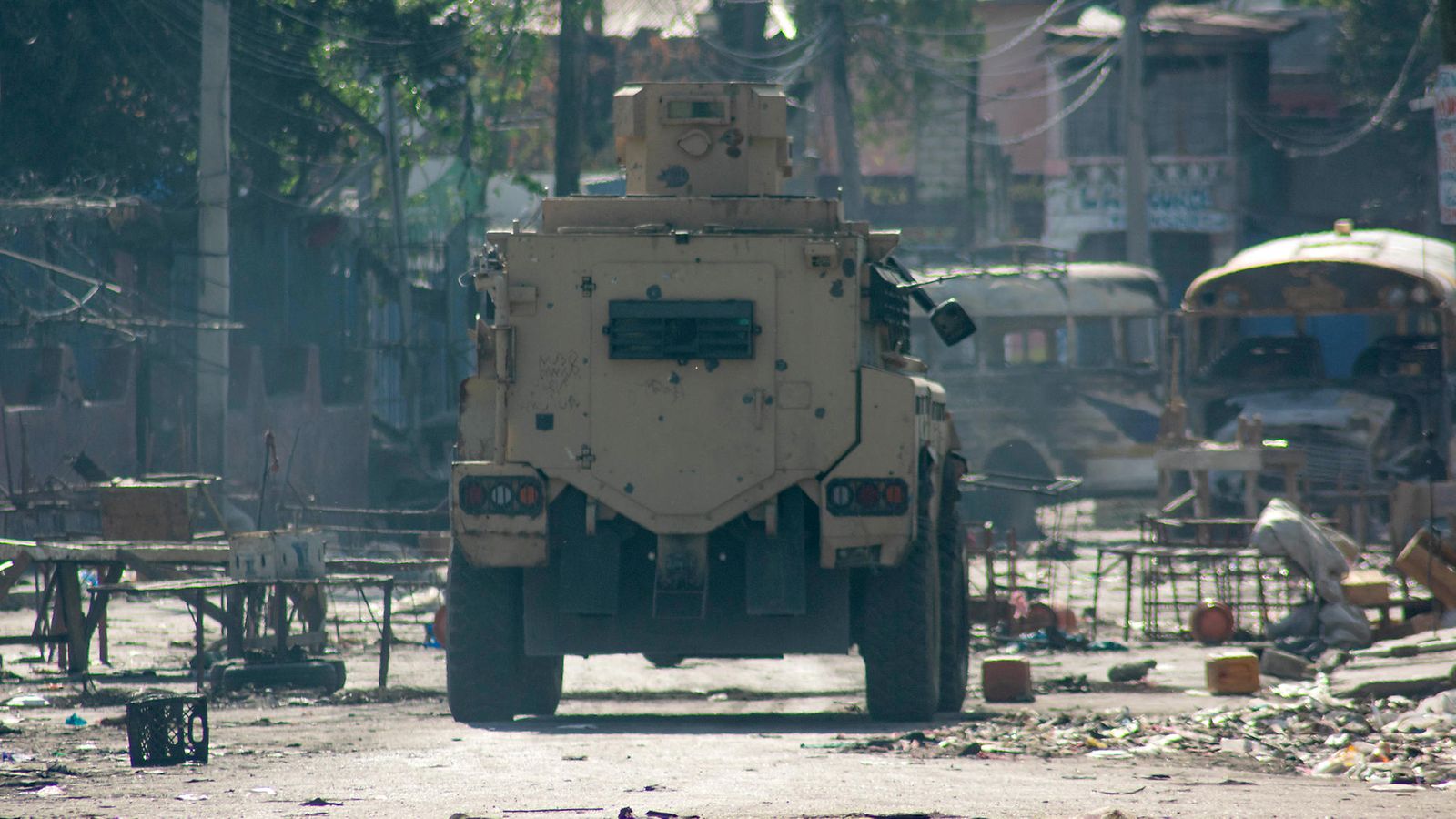 epa11195653 An armored car patrols the streets during the ongoing civil unrest in the city center in Port-au-Prince, Haiti, 02 March 2024. Sporadic shootings and acts of looting continue in several neighborhoods in the metropolitan area of Port-au-Prince, creating a situation of constant fear, uncertainty, and alertness in the population.