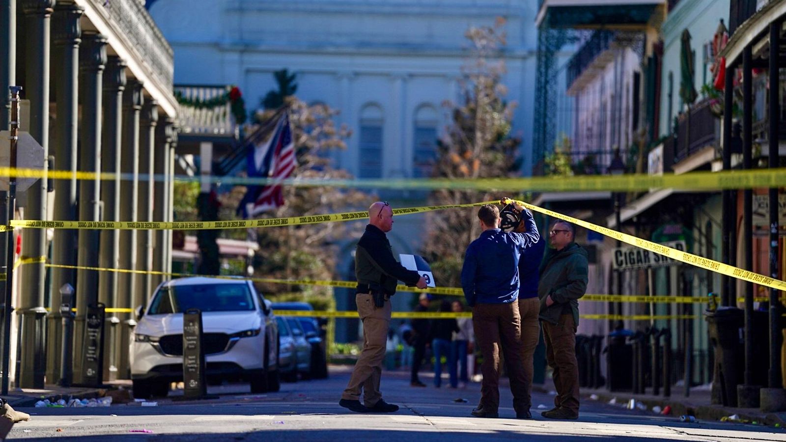 Police and officials survey an area in the French Quarter on Orleans Street near the St. Louis Cathedral in New Orleans, Louisiana on Wednesday,