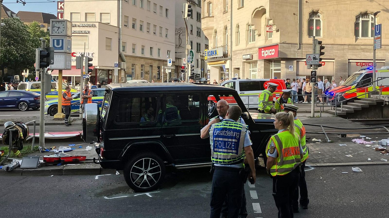 Baden-Wurttemberg, Stuttgart: Police officers and emergency workers present at the scene where a car drove into people. According to police, a car has driven into a group of people in Stuttgart city center.