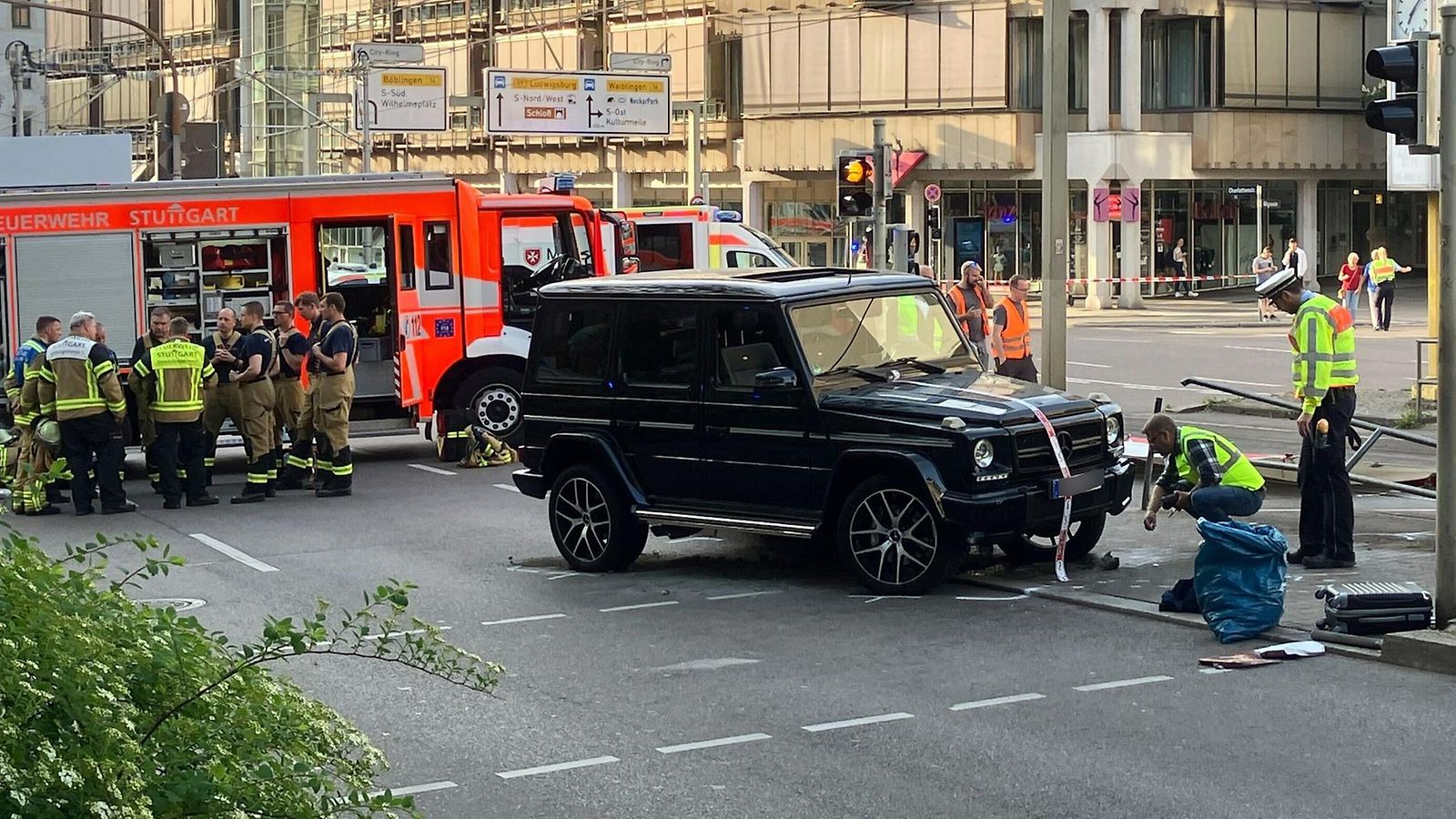 Baden-Wurttemberg, Stuttgart: Police officers and emergency workers present at the scene where a car drove into people. According to police, a car has driven into a group of people in Stuttgart city center.