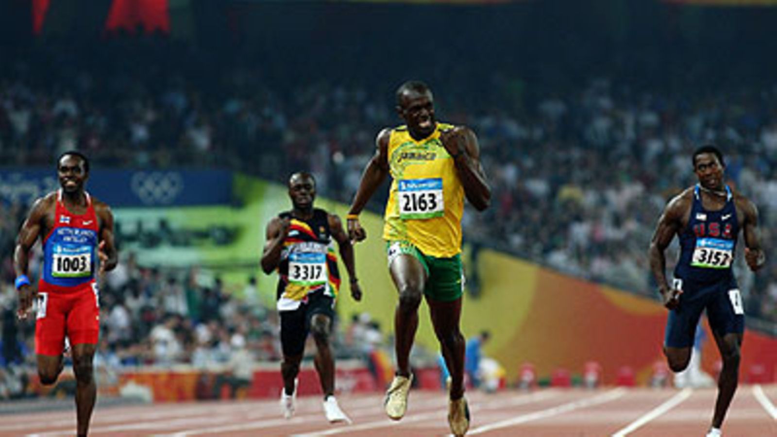 Usain Bolt rullaa maaliin. Kuva Michael Steele/GETTY.